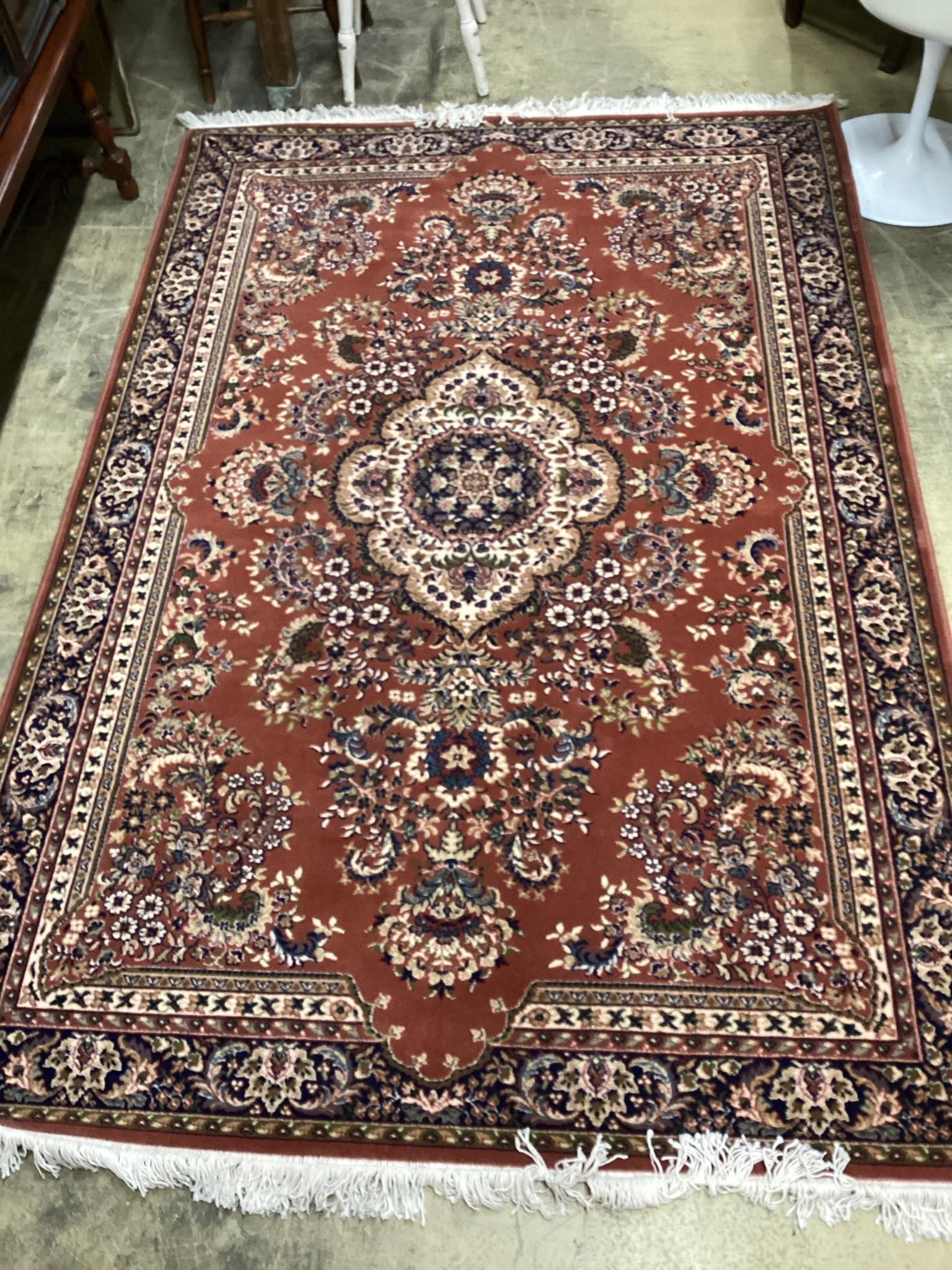 A modern Tabriz style red ground rug, 240 x 162cm